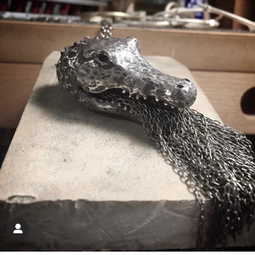 Heavy sterling crocodile pendant with chain.